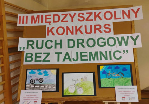 Tablica z napisem: III Międzyszkolny Konkurs pt. "Ruch drogowy bez tajemnic".