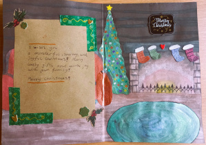 Środek kartki wykonanej przez naszą uczennicę, która zdobyła 3 miejsce w międzyszkolnym konkursie językowo-plastycznym „Życzenia z różnych stron świata”.