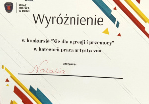 Dyplom dla uczennicy nagrodzonej pracy konkursowej